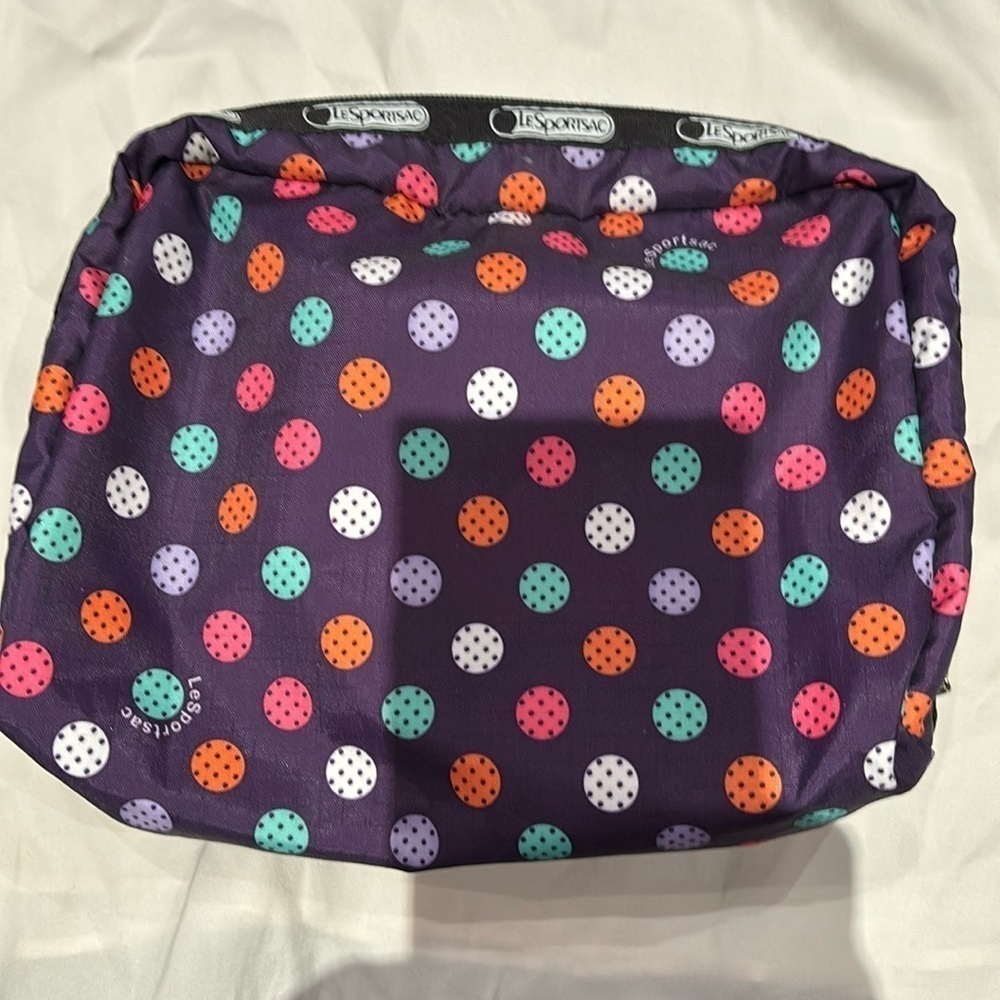 LeSportsac makeup case in purple black white with polka dots